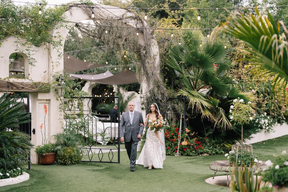 Bride entering the garden ceremony at Tivoli in Fallbrook