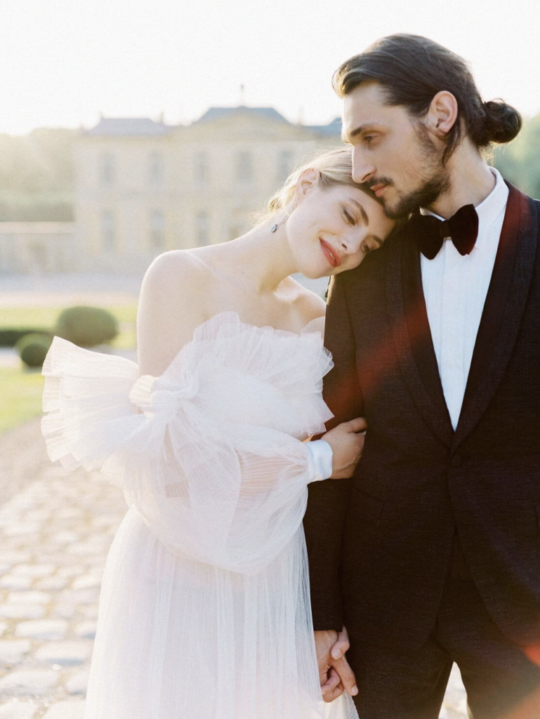 Bride and groom embracing in a Dreamwood wedding portrait