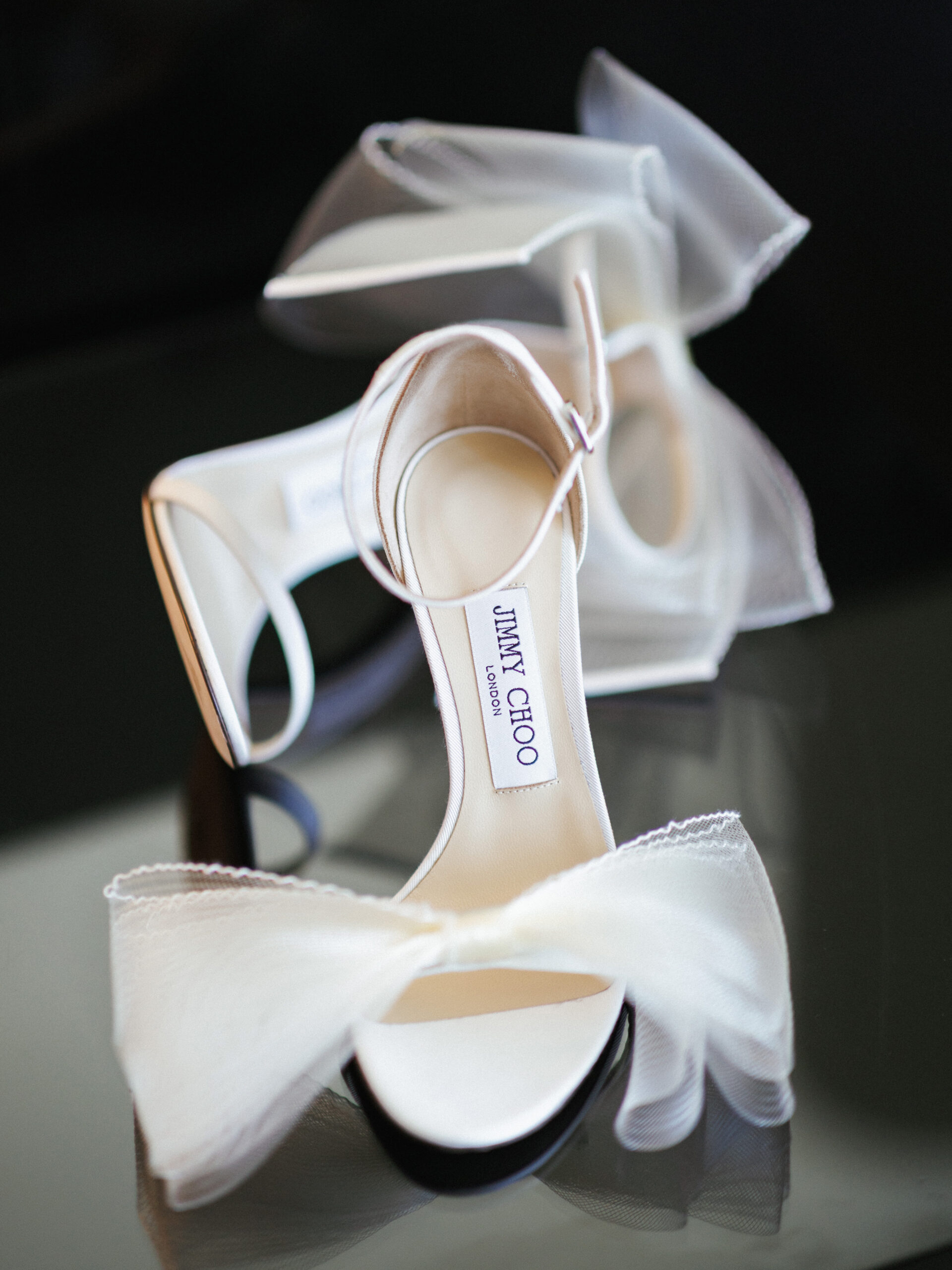 Bridal shoes and wedding rings detail