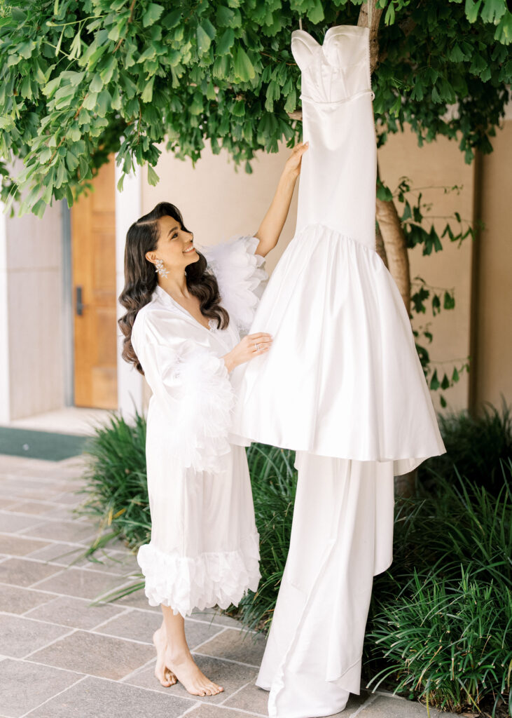 Romantic bridal photoshoot with a wedding gown during morning preparations.