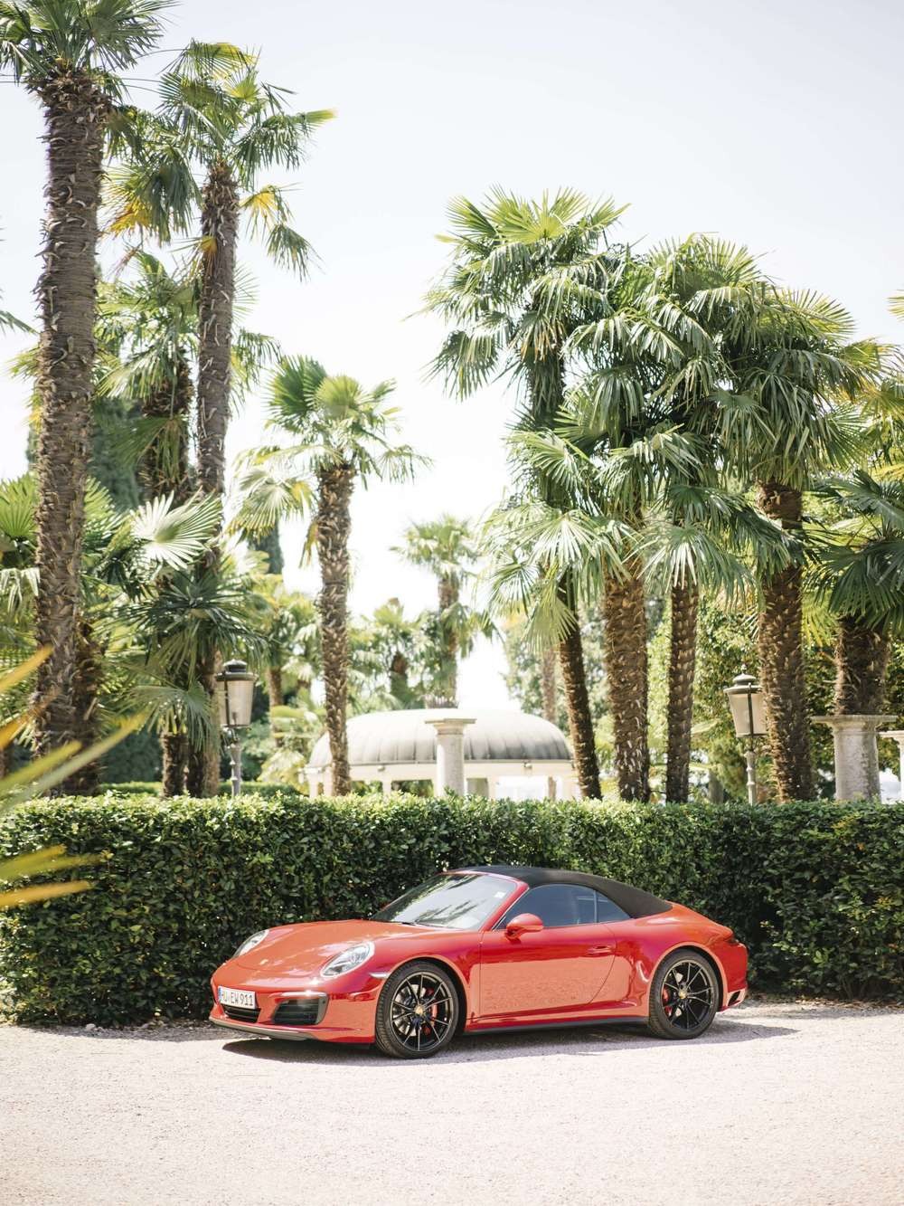 Estate arrival with classic car and palms