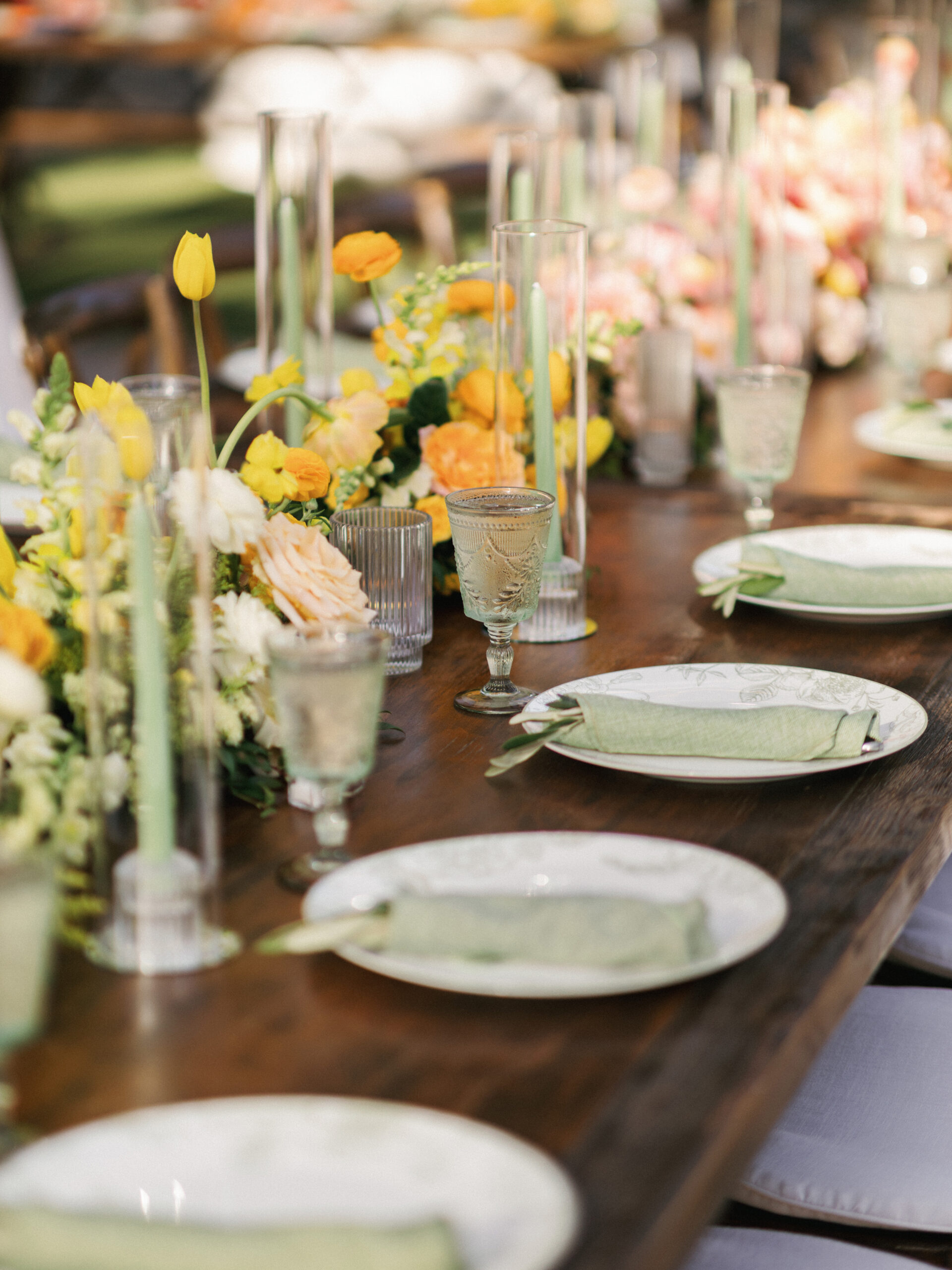 Reception table setting with candles and florals