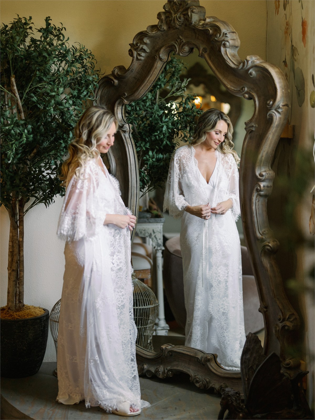 Two brides standing together in a mirrored room