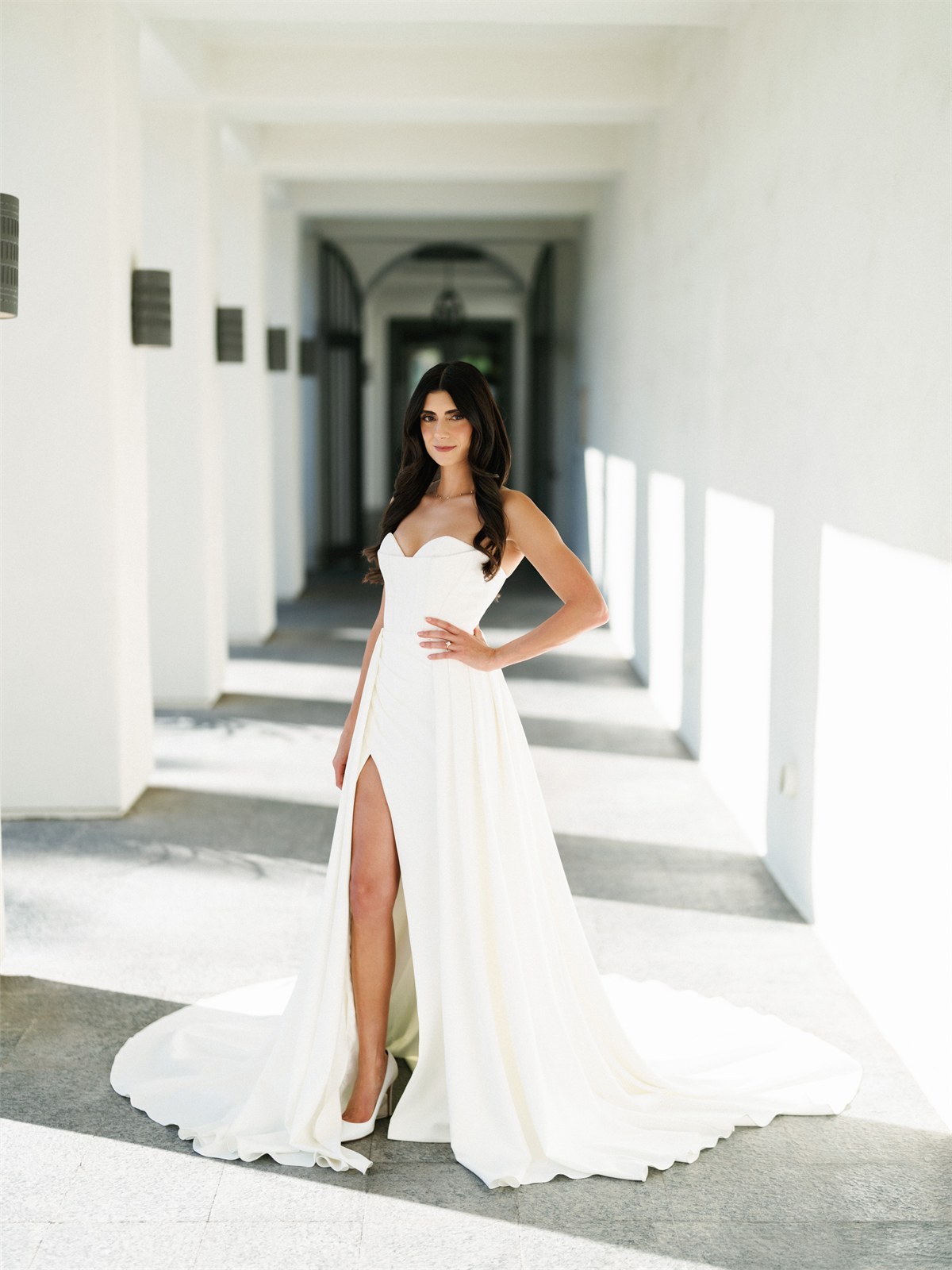 Bride standing in a bright interior