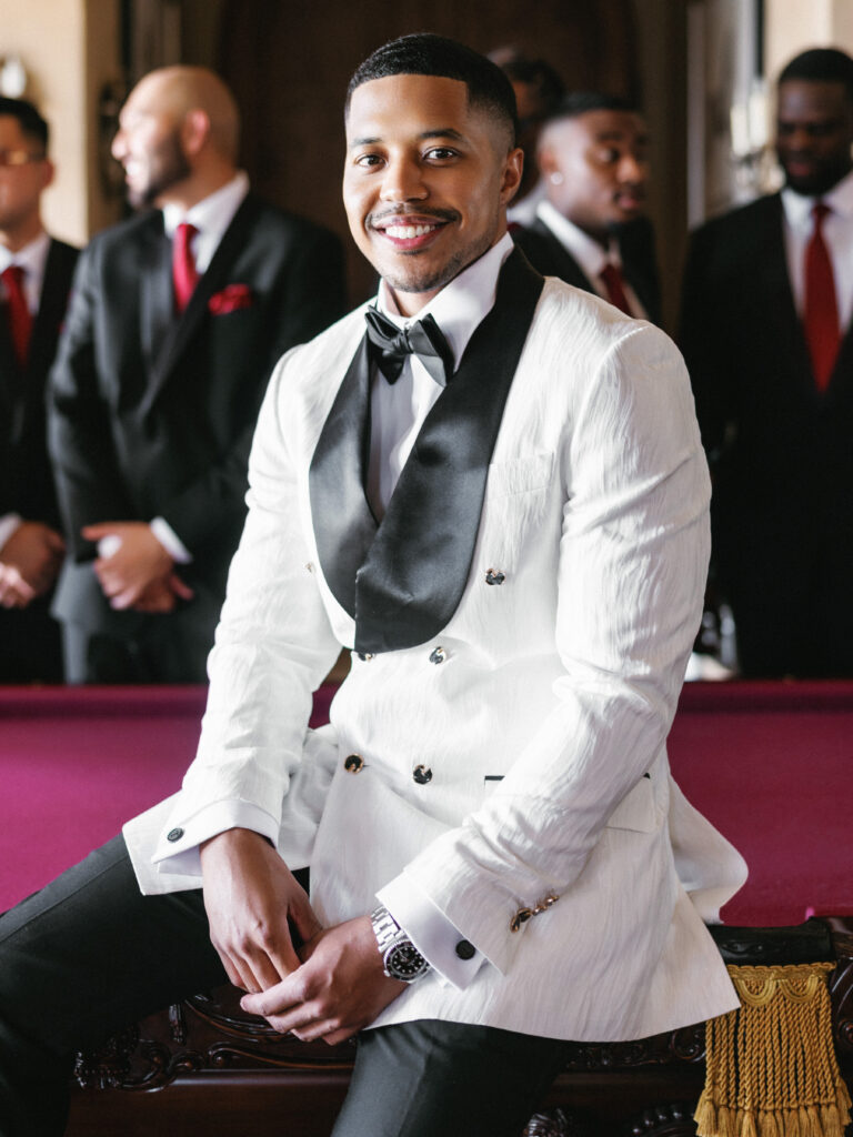High-fashion groom portrait at a private estate wedding, modern bespoke tuxedo styling inspiration for a luxury black-tie American wedding.