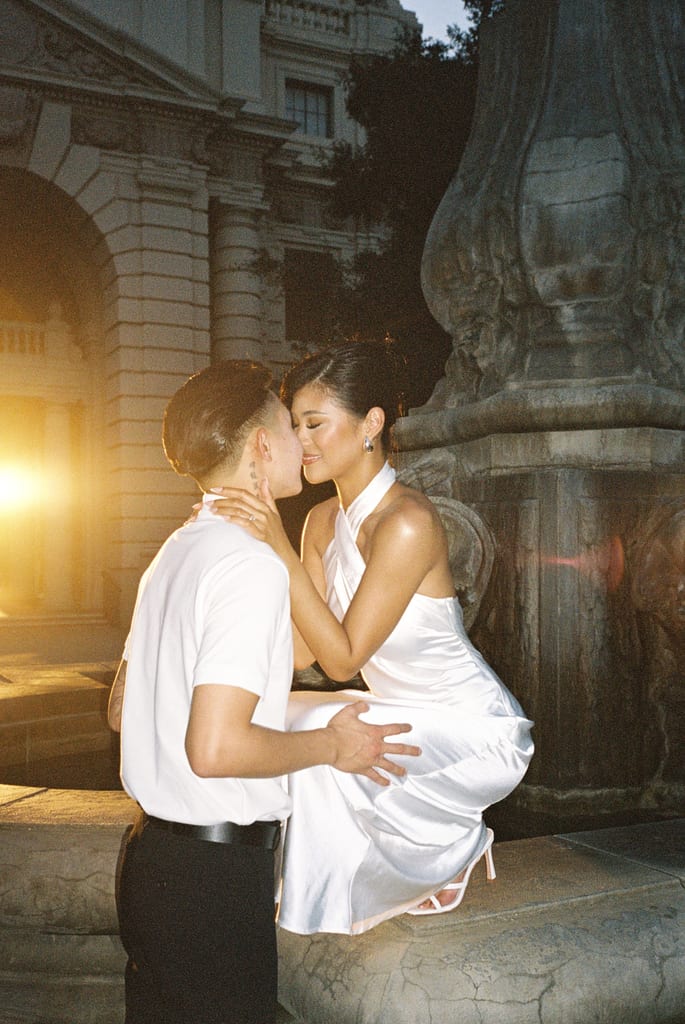 Couple kissing outdoors after the ceremony at night