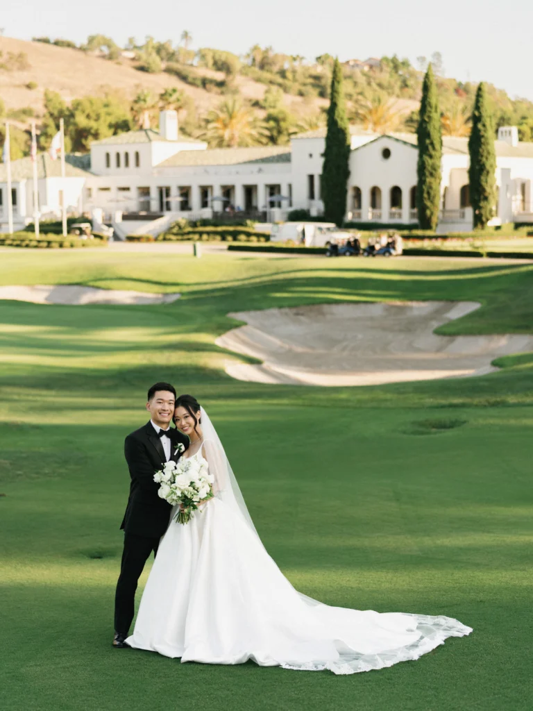 Luxury wedding photography package investment featuring a classic bride and groom portrait on the manicured golf course at The Riviera Country Club in Pacific Palisades.