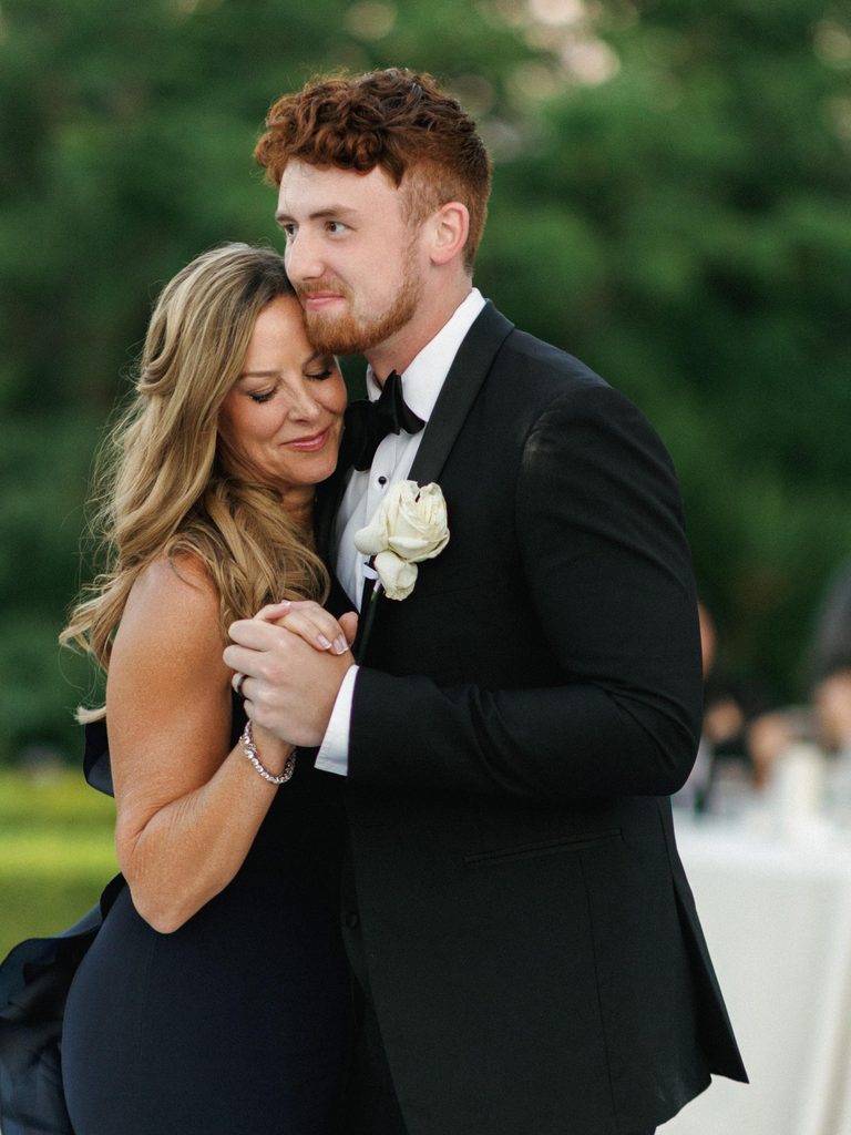 Groom shares a touching moment with his mother on the dance floor in these heartfelt wedding reception photos