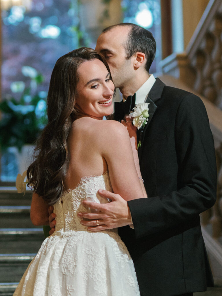Tender close-up of a luxury wedding couple sharing an intimate moment, highlighting romantic, documentary-infused wedding photography styles.