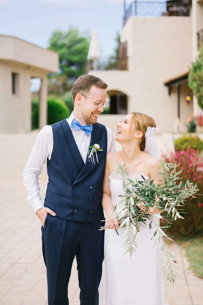 Joyful newlyweds enjoying their outdoor stroll under bright natural daylight
