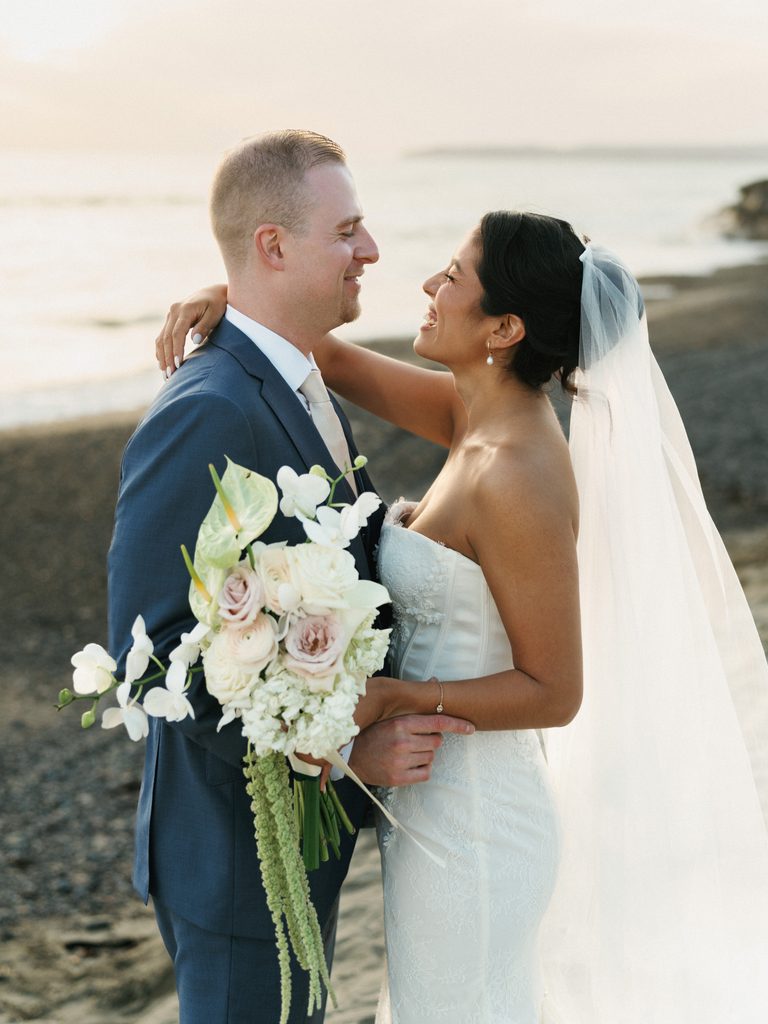 Luxury couple portrait featuring a beautiful white orchid and anthurium wedding bouquet