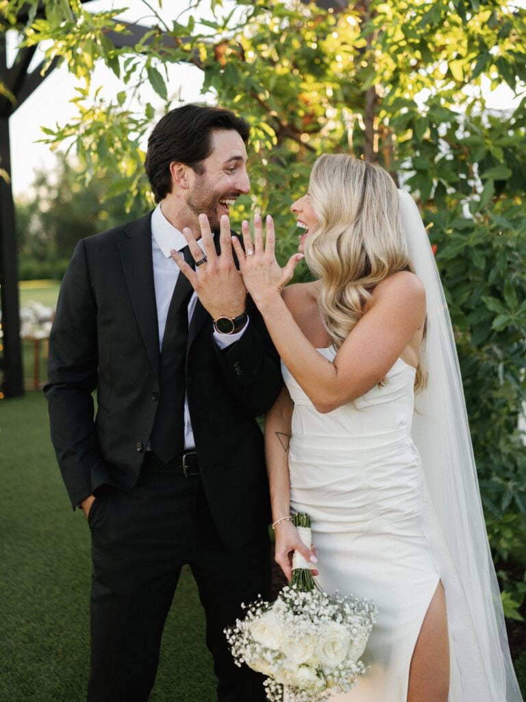 Newlyweds celebrate together during a garden portrait