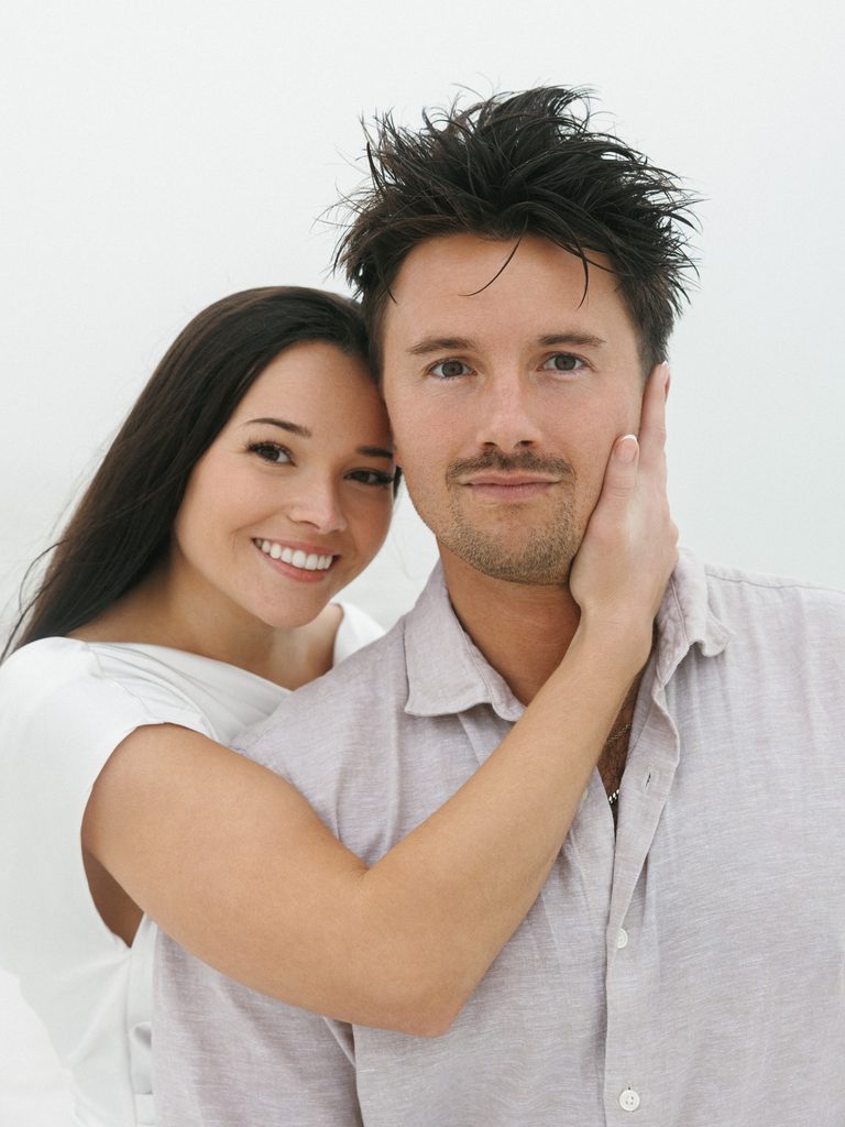 Close-up portrait of a couple in neutral tones, showcasing minimal and elegant styles for engagement photo outfits.