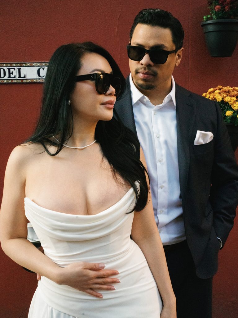 Trendy couple portrait wearing chic sunglasses inspiring modern fashion forward engagement photo ideas