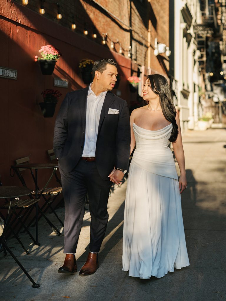 Golden hour stroll along a brick cafe patio showcasing editorial city style engagement photo ideas