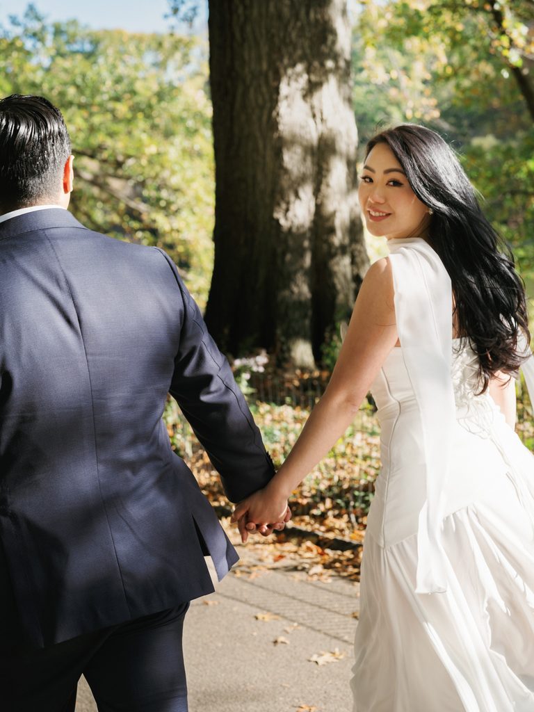 Candid follow me pose on a park path illustrating dynamic engagement photo ideas