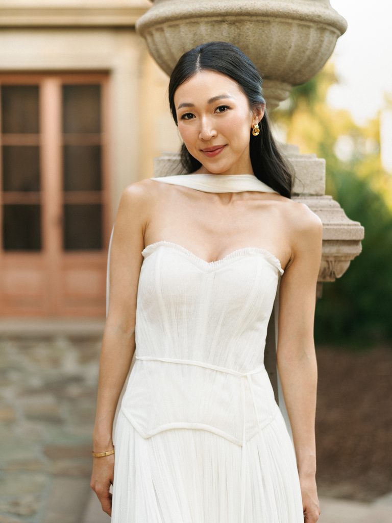 Editorial white dress inspiration for modern and sophisticated engagement photo outfits.