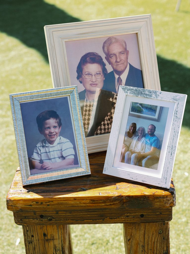 Close-up of framed family heritage photos, capturing meaningful details for a wedding photo gallery.