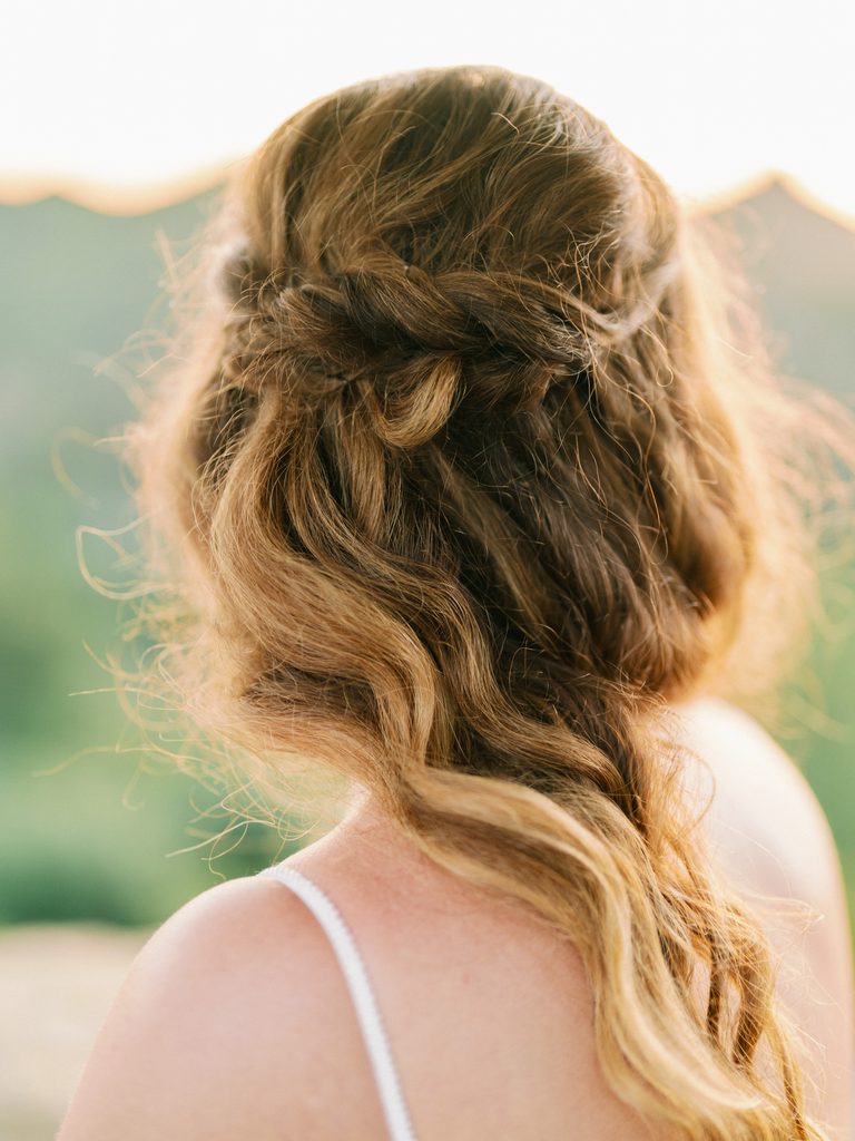 Close-up of a braided bridal hairstyle, capturing fine-art details for a wedding photo gallery.