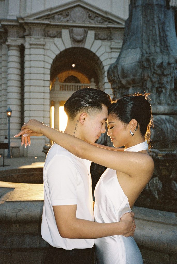 Close up portrait of embracing couple outdoor luxury city wedding venue