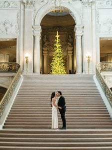 Elegant bride and groom posing indoor for luxury winter wedding photography in California