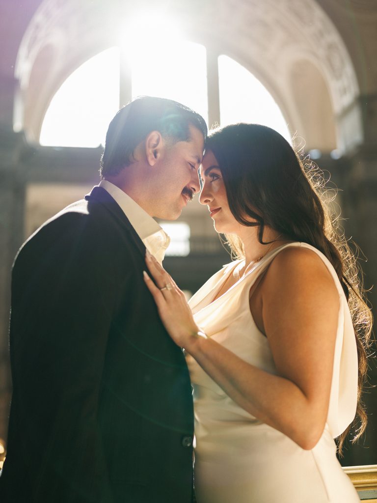 Intimate couple portraits inside historic building luxury California winter wedding inspiration
